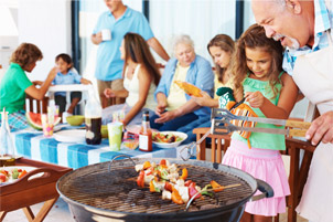 Girl and Grandfather Grilling