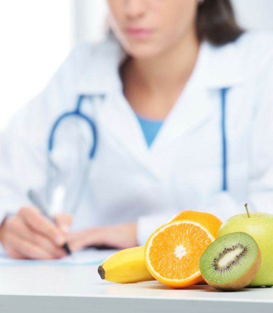 image of doctor with fruit on her desk