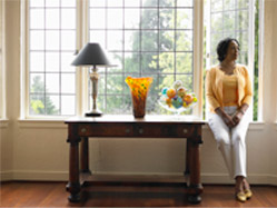 image of woman sitting near a window in Michigan home