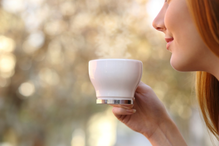 image of young woman drinking coffee