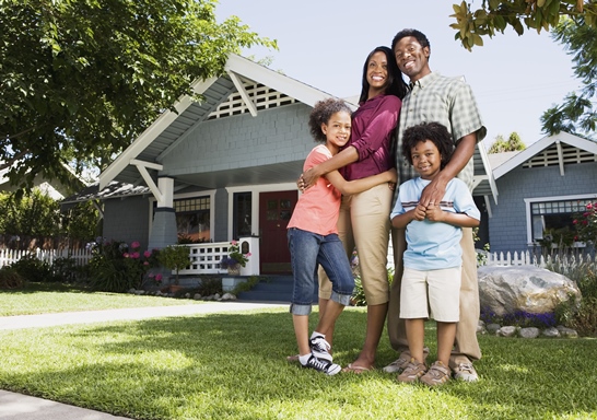 image of family outside michigan home