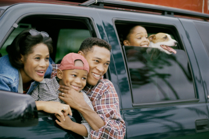 family looking out car windows